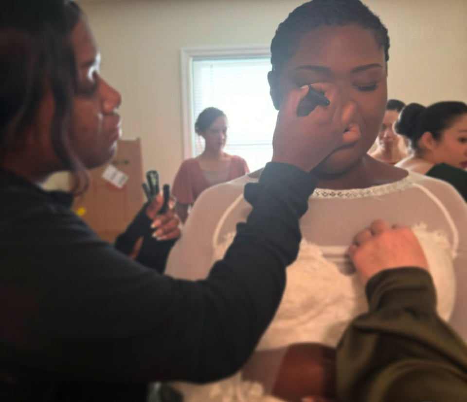 Bridal hair and makeup application with makeup artist at Vela Lash Bar.